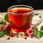 Galagonya tea with flowers on a wooden table